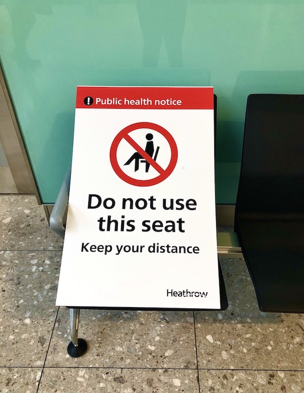 social distancing sign board at Heathrow Airport